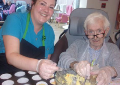 A Loose Valley resident and staff member making muffins