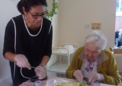 A Loose Valley resident and staff member making fruit scones