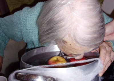 Loose Valley resident bobbing for apples at the Halloween party