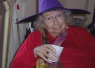 Loose Valley resident wearing a purple witch hat for Halloween