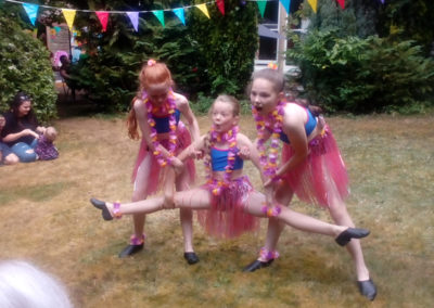 Three girls from the Hilton Dance Academy performing at Loose Valley Care Home