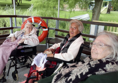 A group of seated residents enjoying a ferry ride