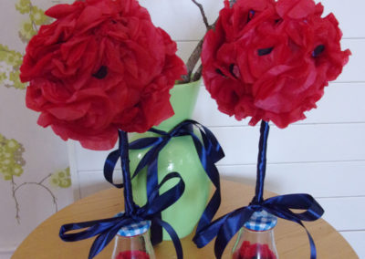 Bunches of handmade poppies from red tissue paper