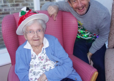 Resident and relative in festive hats at Loose Valley