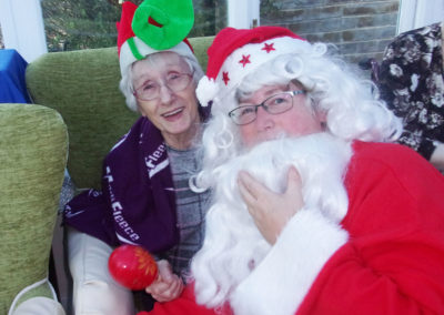 Resident and staff member dressed as Santa at Loose Valley