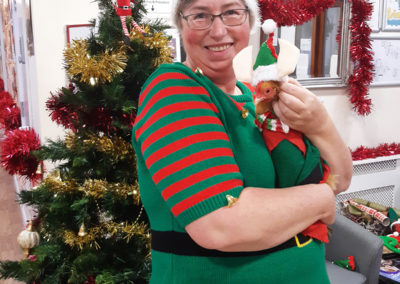 Staff member and a chicken dressed up as elves at Loose Valley