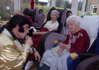 Elvis impersonator with residents at Loose Valley