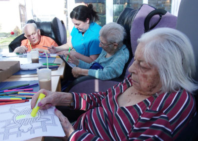 Residents and staff at Loose Valley colouring in Australian themed pictures