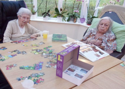 Residents doing puzzles together