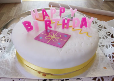 Birthday cake with pink candles