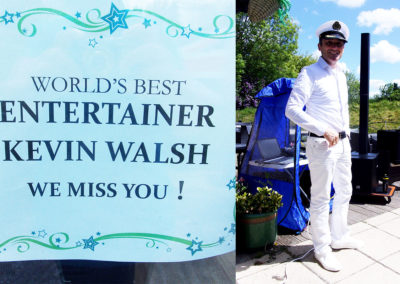 Kevin Walsh poster and Kevin dressed in white sailor uniform