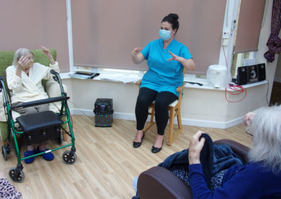 Loose Valley Care Home staff member leading an exercise class