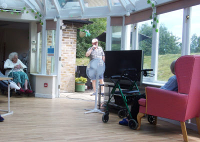 Entertainer Rick Stills performing at Loose Valley Care Home, from the garden