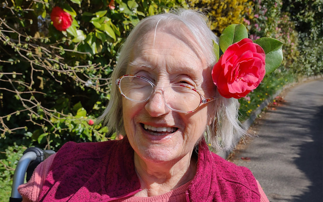 Jean enjoys the sunshine and flowers at Loose Valley Care Home