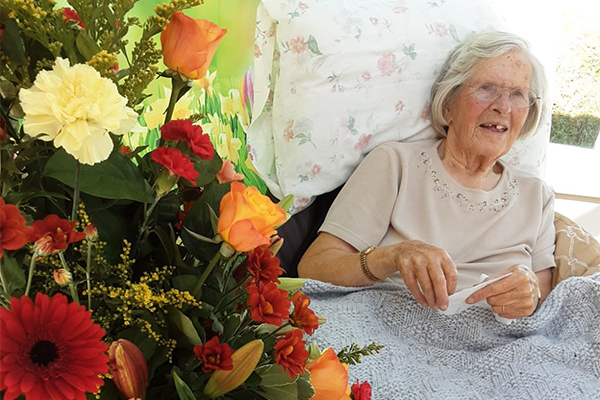 Loose Valley Care Home resident with her wedding anniversary flowers