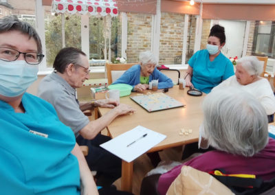 Loose Valley Care Home residents playing Scrabble together