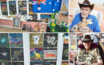 Residents enjoying an Australia-themed armchair travel event with decorations, props and creative artwork at Loose Valley Care Home.