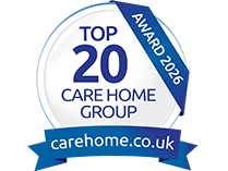 Top 20 Care Home Group award badge for 2026, featuring a blue and white circular design with the website carehome.co.uk displayed below.